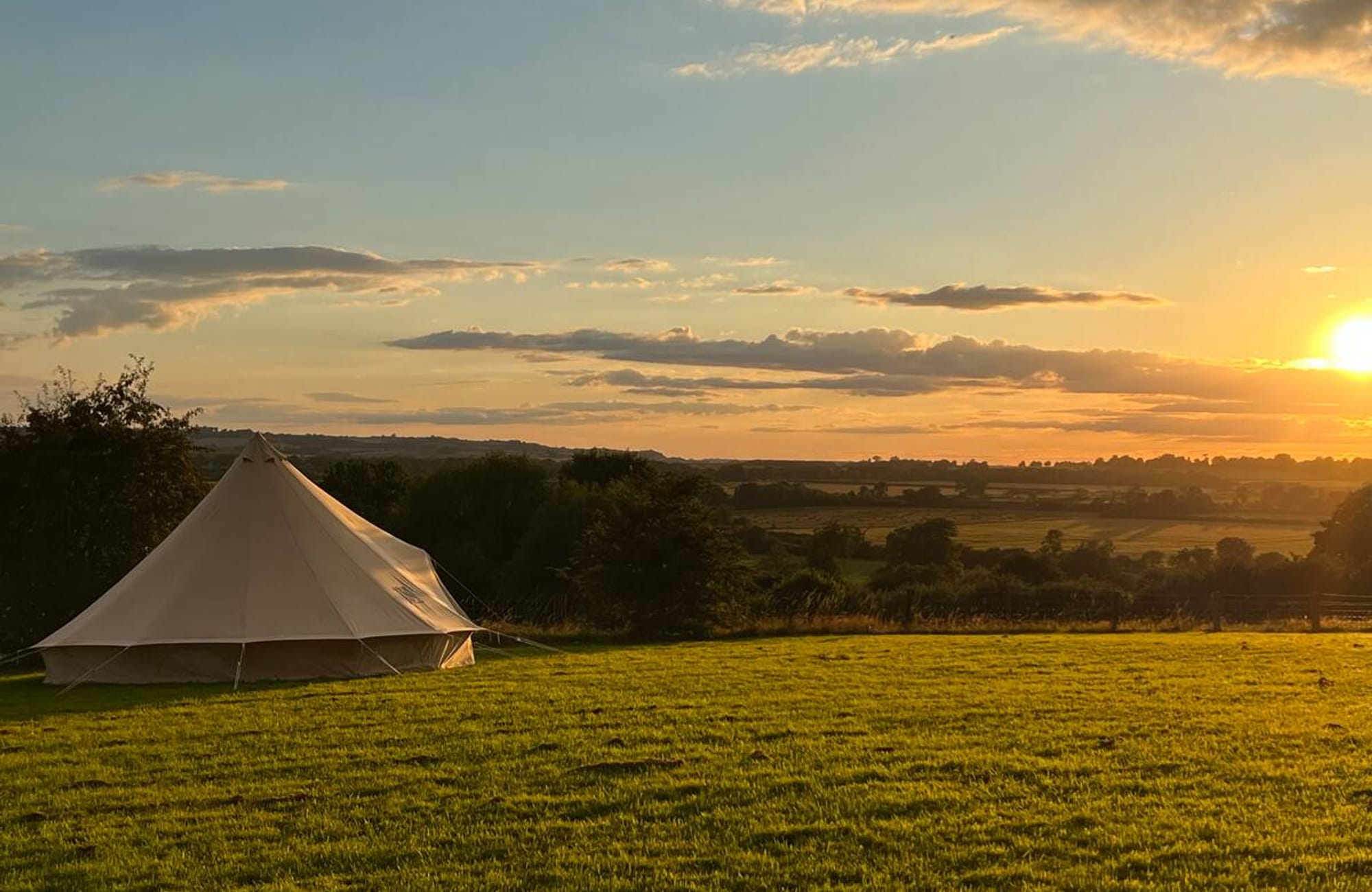 Bell tent on the hill at sunset